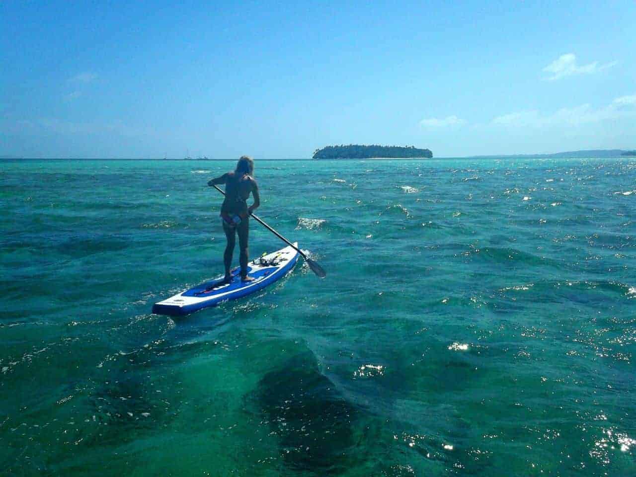 Mandy paddling to one of the island on the mistral inflatable sup